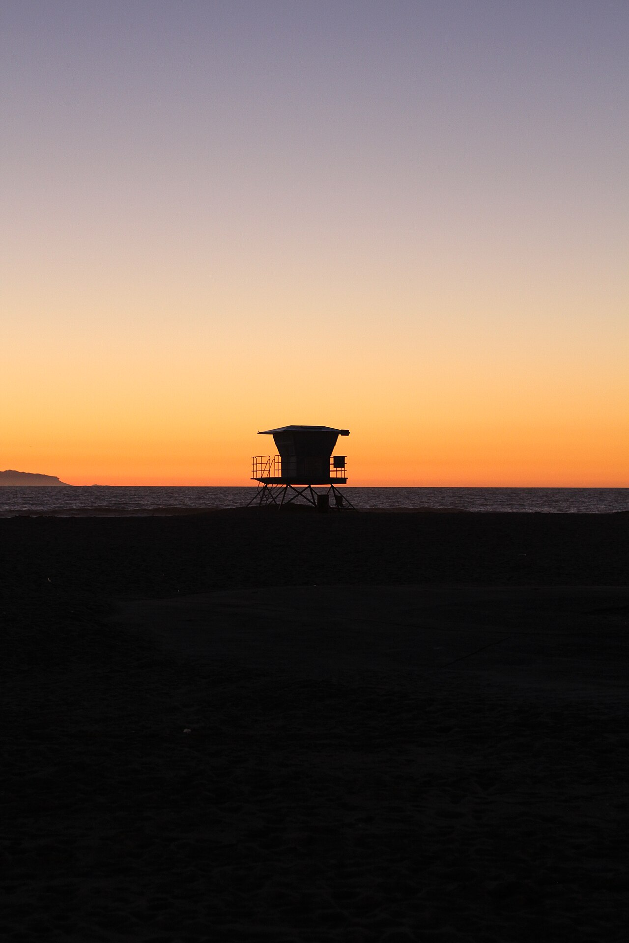 Lifeguard tower on the sand at Huntington Beach