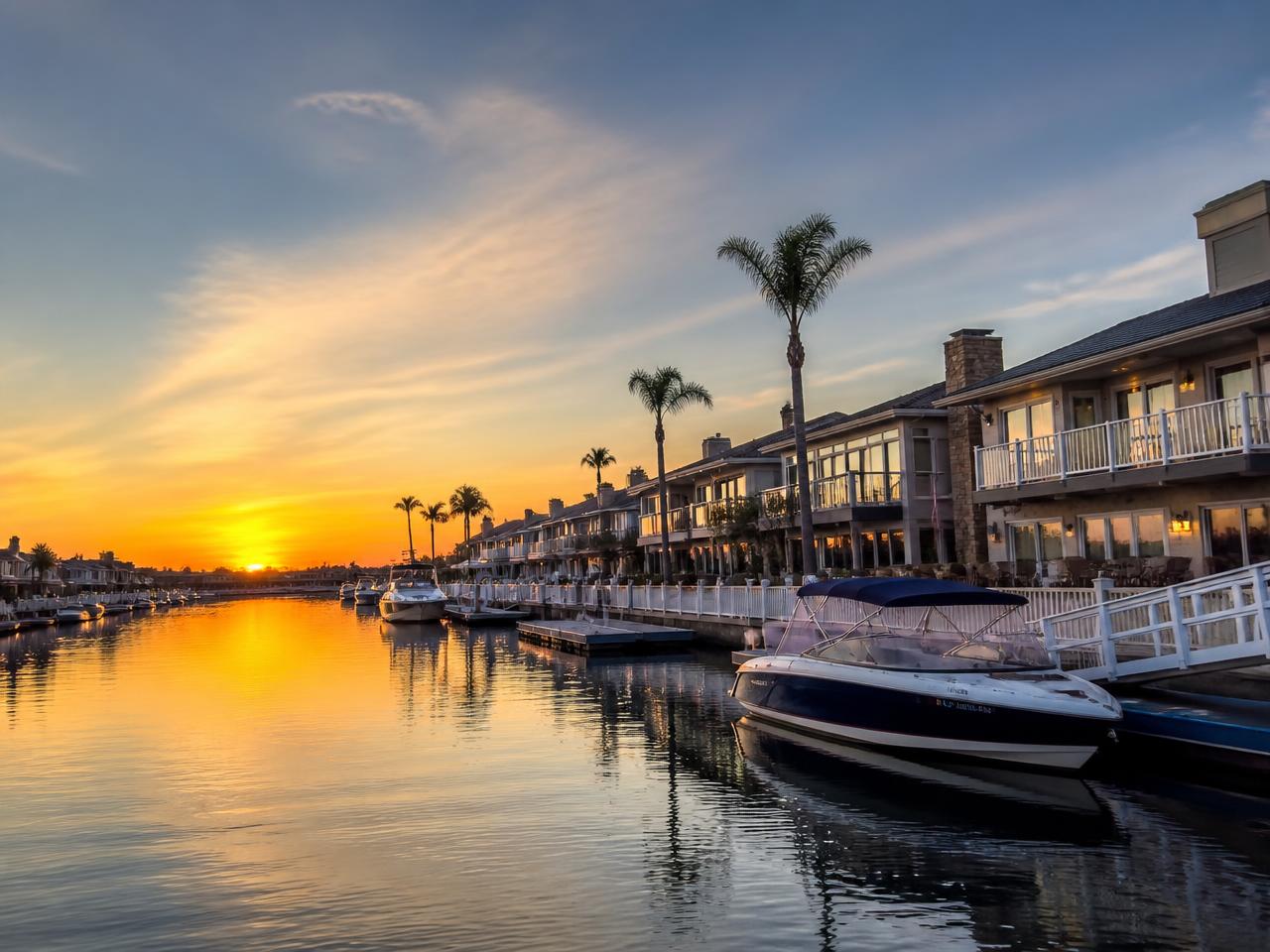 Huntington Harbour canal homes and private docks at sunset
